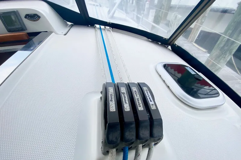 Slide: The Image of Deck of 2008 Hunter 41 Aft Cockpit sailboat with rope clutches and hatch. - 58