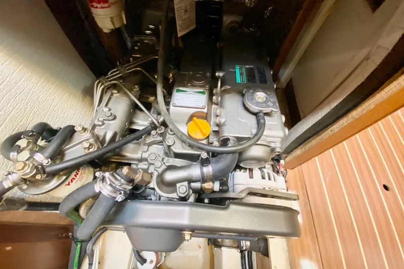 Slide: The Image of Engine compartment of 2008 Hunter 41 Aft Cockpit sailboat, showcasing detailed mechanical components. - 60