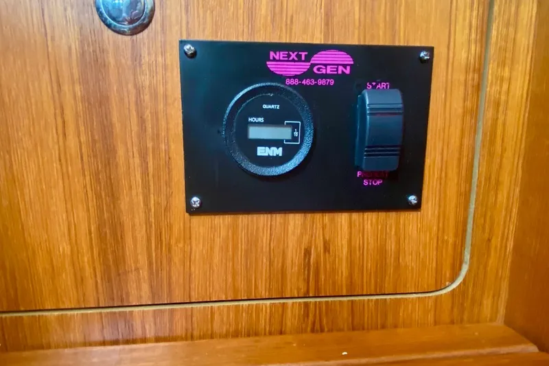 Slide: The Image of Control panel on 2008 Hunter 41 Aft Cockpit yacht, featuring Next Gen generator controls. - 36