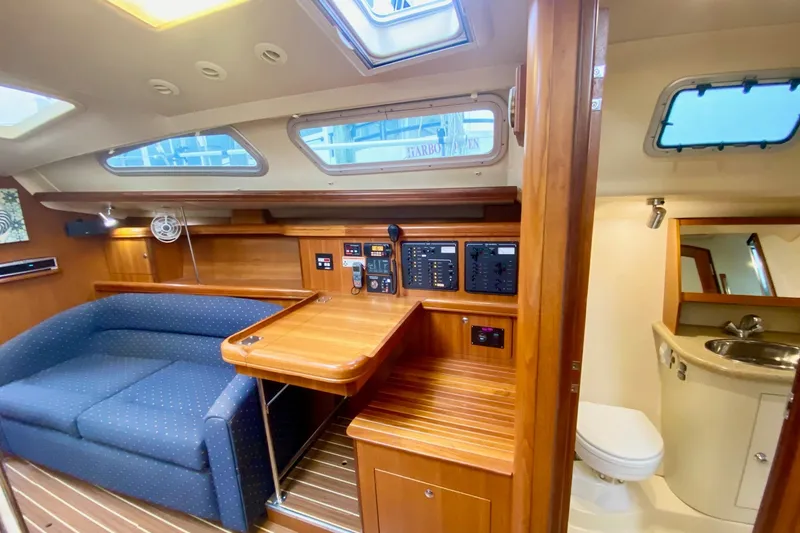 Slide: The Image of Interior of 2008 Hunter 41 Aft Cockpit yacht with seating, table, and bathroom. - 15