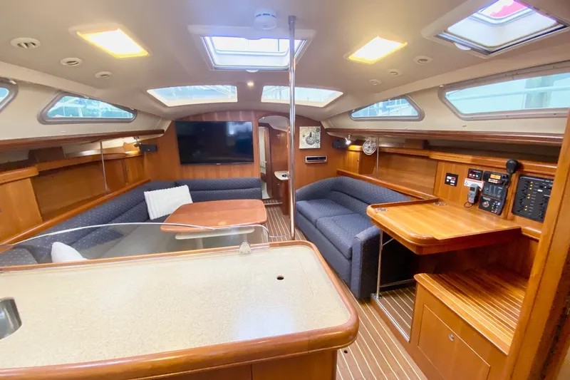 Slide: The Image of Luxurious interior of 2008 Hunter 41 Aft Cockpit yacht with wood finish and modern amenities. - 13