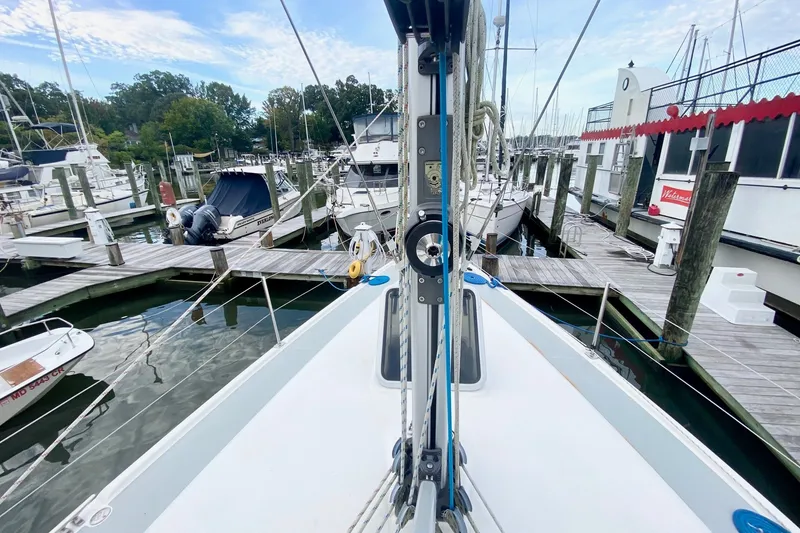 Slide: The Image of Hunter 41 Aft Cockpit sailboat docked at marina, 2008 model, surrounded by other boats. - 45