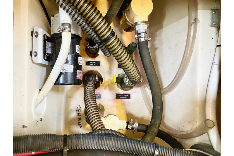 Slide: The Image of Engine compartment of 2008 Hunter 41 Aft Cockpit with hoses and mechanical components. - 61