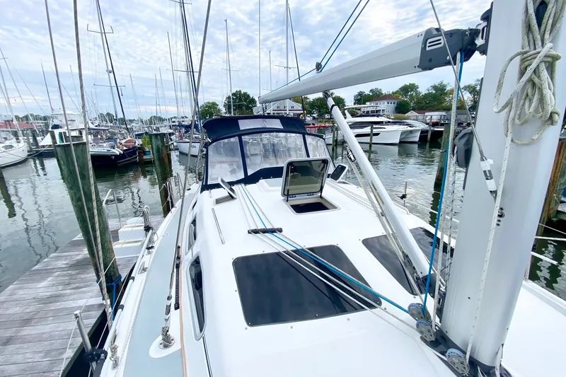 Slide: The Image of 2008 Hunter 41 Aft Cockpit sailboat docked at a marina, surrounded by other boats. - 40