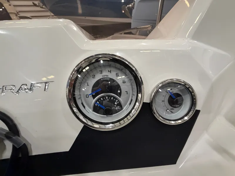 Slide: The Image of Close-up of a Starcraft boat's dashboard with tachometer and fuel gauge. - 17