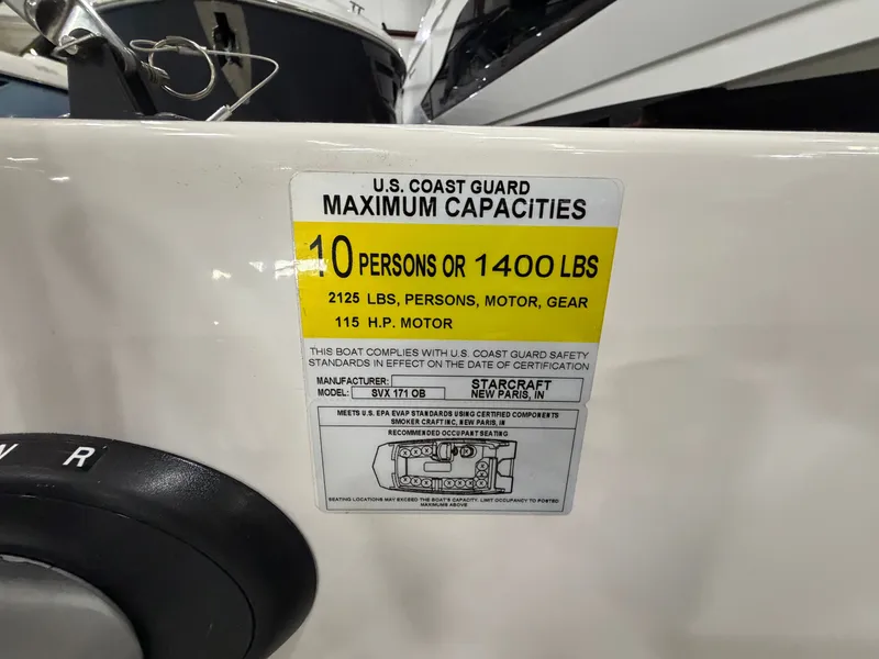 Slide: The Image of Label on a boat showing capacity information and manufacturer details. - 18
