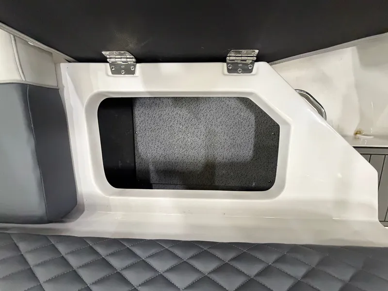 Slide: The Image of A cushioned seating area with a rectangular opening and hinges. - 27