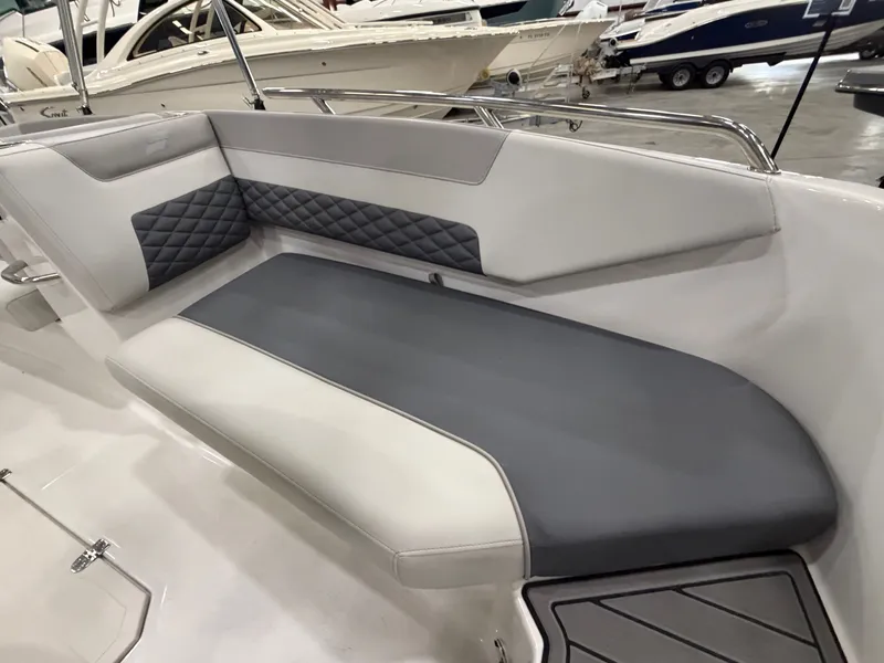 Slide: The Image of The image shows a gray and white seating area in a modern boat. - 21
