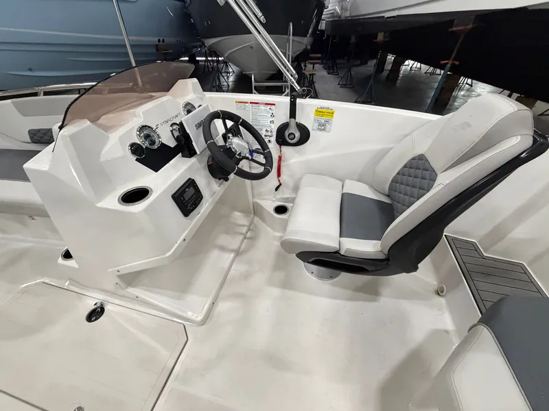 Slide: The Image of The image shows the cockpit of a 2026 Starcraft SVX 171 OB with a modern helm. - 13