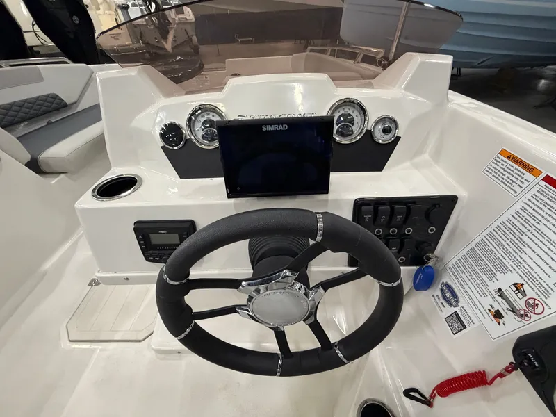 Slide: The Image of The 2026 Starcraft SVX 171 OB cockpit features a modern steering wheel and instruments. - 14