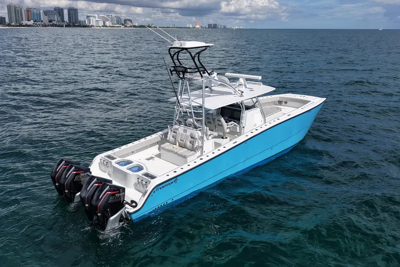 Slide: The Image of 2024 Freeman 42LR boat on ocean, city skyline in background. - 3