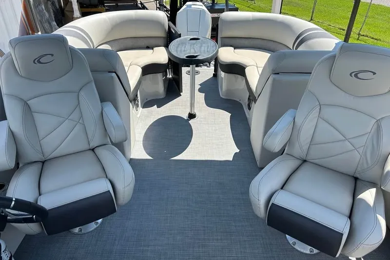 Slide: The Image of 2019 Crest Classic 230 SLC boat interior with plush seating and modern design. - 13