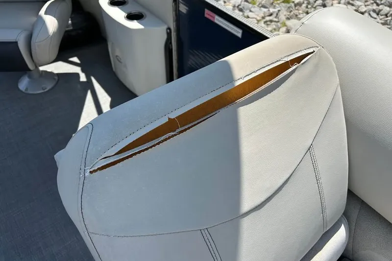 Slide: The Image of Torn upholstery on a 2019 Crest Classic 230 SLC boat seat. - 12