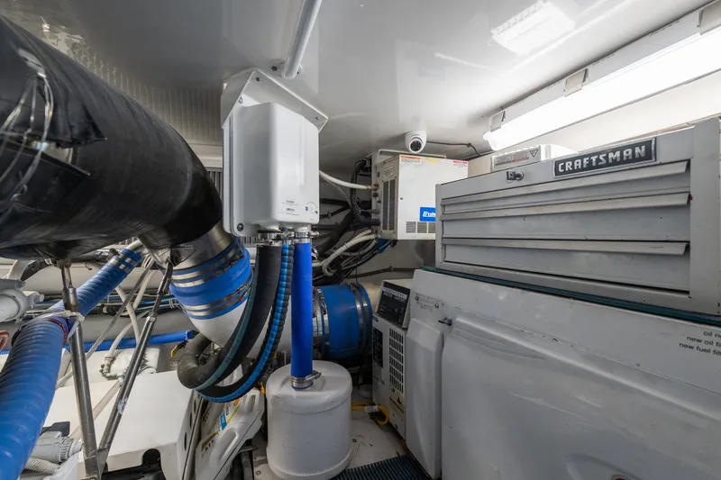 Slide: The Image of Engine room of 2005 Hatteras 60 Convertible yacht with Craftsman toolbox and equipment. - 47