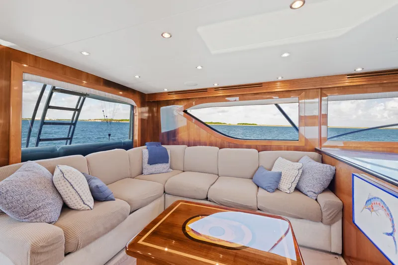 Slide: The Image of Luxurious interior of 2005 Hatteras 60 Convertible yacht with ocean view and plush seating. - 5