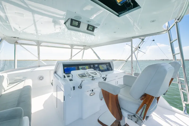 Slide: The Image of Luxurious helm of 2005 Hatteras 60 Convertible yacht with modern navigation equipment. - 27