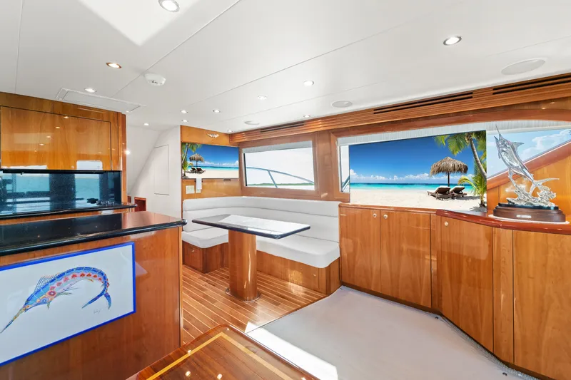 Slide: The Image of Luxurious interior of 2005 Hatteras 60 Convertible yacht with beach view decor. - 6