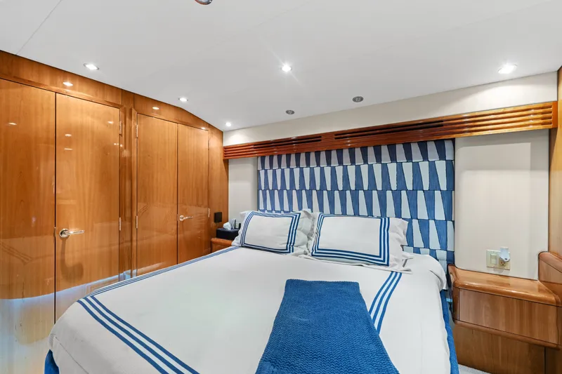 Slide: The Image of Luxurious bedroom interior of 2005 Hatteras 60 Convertible yacht with elegant wood finishes. - 13