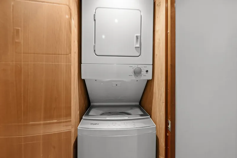 Slide: The Image of Stacked washer and dryer in 2005 Hatteras 60 Convertible yacht interior. - 26