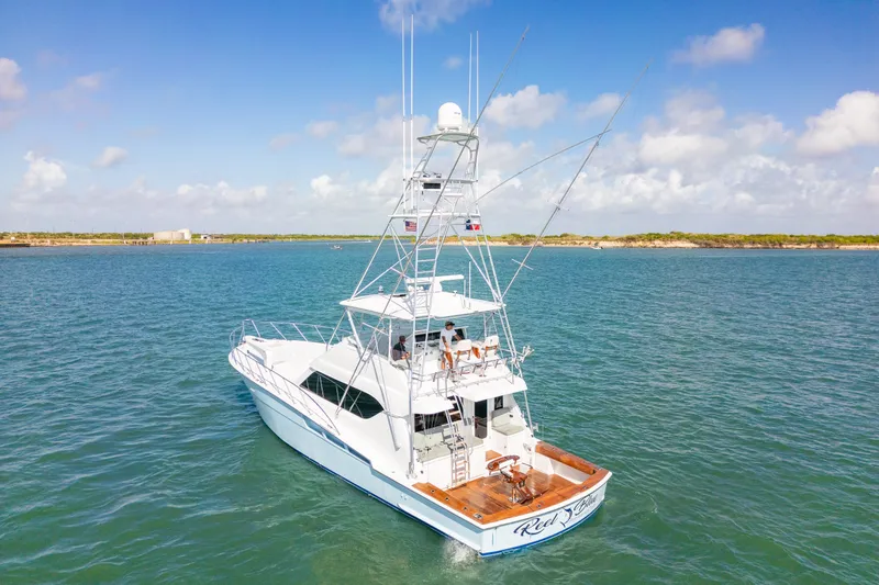 Slide: The Image of 2005 Hatteras 60 Convertible yacht cruising on a sunny day. - 1