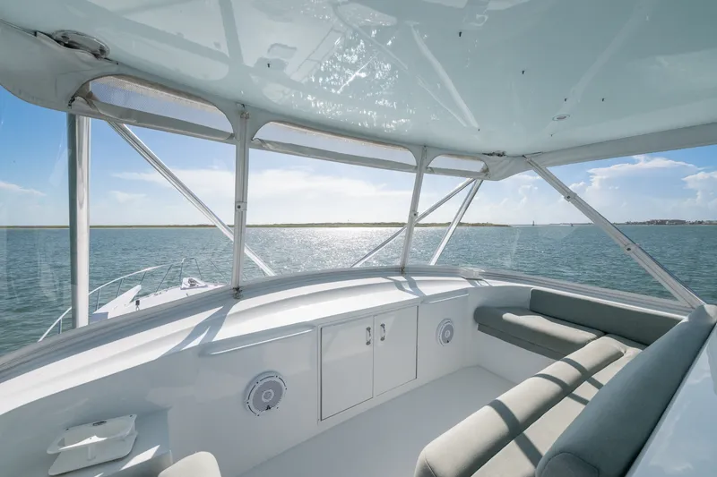 Slide: The Image of 2005 Hatteras 60 Convertible yacht interior with ocean view and comfortable seating. - 33