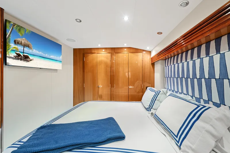 Slide: The Image of Luxurious bedroom interior of 2005 Hatteras 60 Convertible yacht with elegant decor. - 14