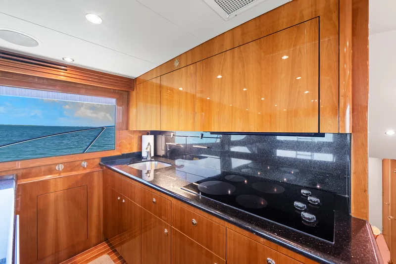 Slide: The Image of Luxurious kitchen interior of 2005 Hatteras 60 Convertible yacht with ocean view. - 11