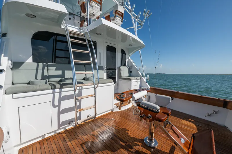 Slide: The Image of 2005 Hatteras 60 Convertible yacht deck with seating and fishing equipment, ocean view. - 40