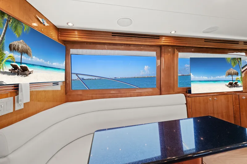Slide: The Image of Luxurious interior of 2005 Hatteras 60 Convertible yacht with ocean view windows. - 8