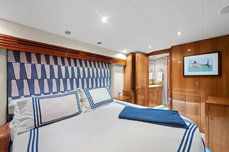 Slide: The Image of Luxurious bedroom interior of 2005 Hatteras 60 Convertible yacht with elegant wood finishes. - 15