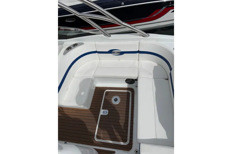 Slide: The Image of 2008 Formula 310 Bowrider interior with white seating and wood flooring. - 4