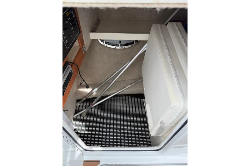 Slide: The Image of Interior view of a 2008 Formula 310 Bowrider boat, featuring seating and storage area. - 11