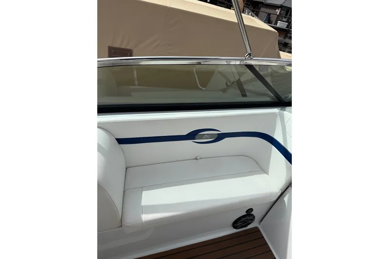 Slide: The Image of 2008 Formula 310 Bowrider interior with white seating and blue accents. - 9