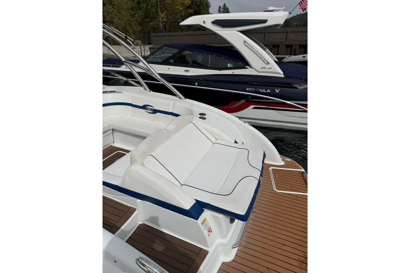 Slide: The Image of 2008 Formula 310 Bowrider with sleek seating and elegant design on the water. - 3