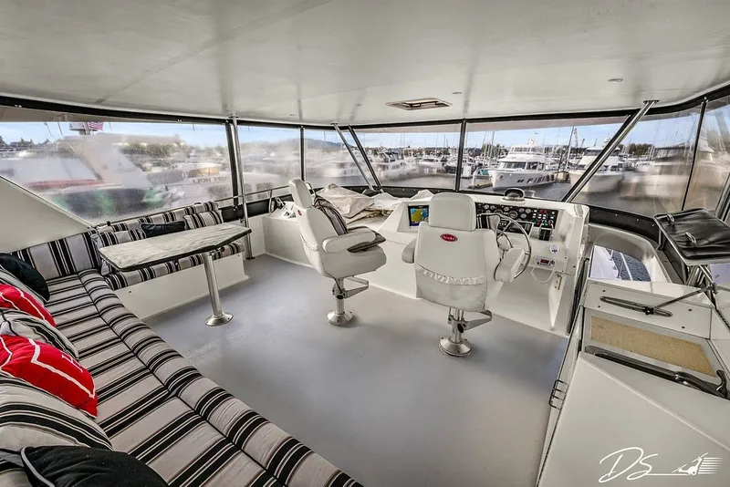 Slide: The Image of Interior of 1993 Tollycraft 57 Pilothouse Motor Yacht with helm and seating area. - 22