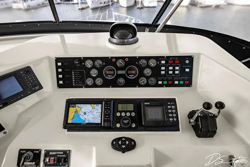 Slide: The Image of Control panel of a 1993 Tollycraft 57 Pilothouse Motor Yacht with navigation instruments. - 25