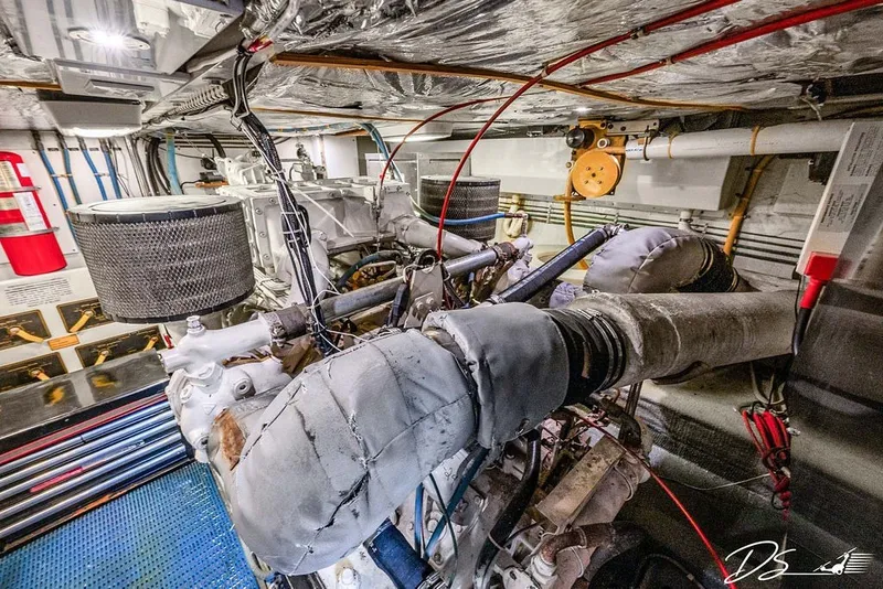 Slide: The Image of Engine room of a 1993 Tollycraft 57 Pilothouse Motor Yacht, showcasing machinery and components. - 40