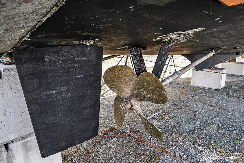 Slide: The Image of Propeller and rudder of 1993 Tollycraft 57 Pilothouse Motor Yacht on dry dock. - 57