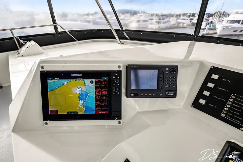 Slide: The Image of Cockpit of 1993 Tollycraft 57 Pilothouse Motor Yacht with navigation equipment. - 24