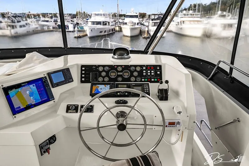 Slide: The Image of Cockpit view of 1993 Tollycraft 57 Pilothouse Motor Yacht with navigation equipment. - 26