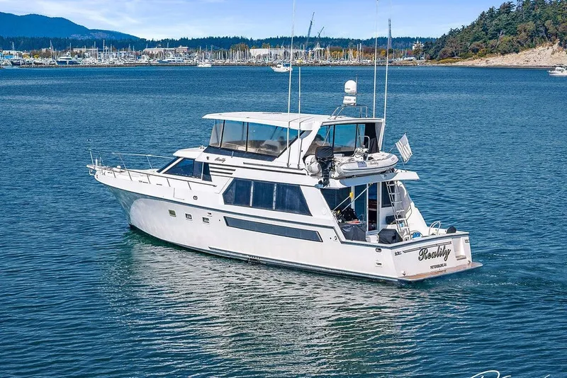 Slide: The Image of 1993 Tollycraft 57 Pilothouse Motor Yacht cruising in scenic waters. - 51