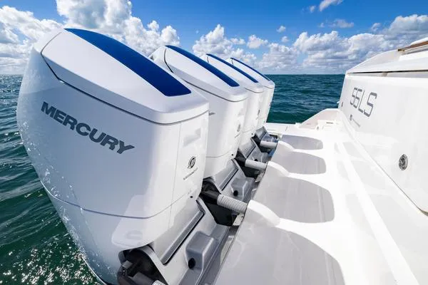 Slide: The Image of 2025 Tiara Yachts 56 LS with Mercury outboard engines on open water. - 21