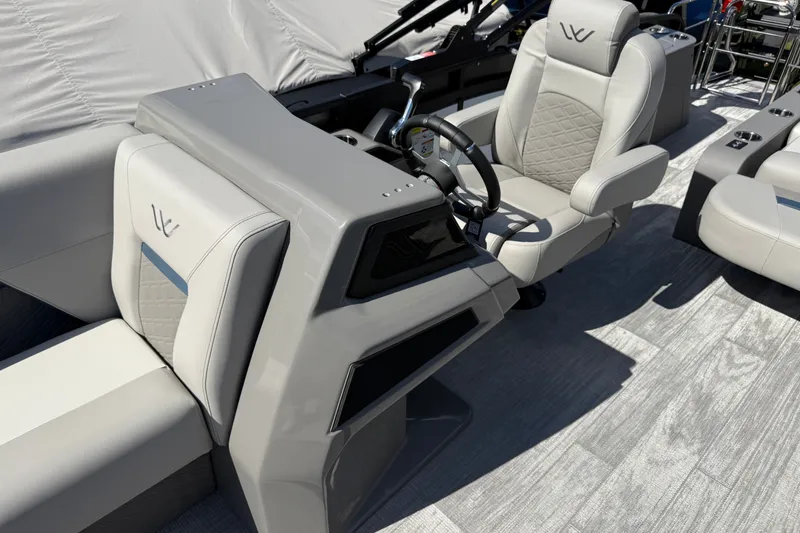 Slide: The Image of Luxurious interior of 2027 Whisper Vision Splash Pad boat with modern steering console and seating. - 13
