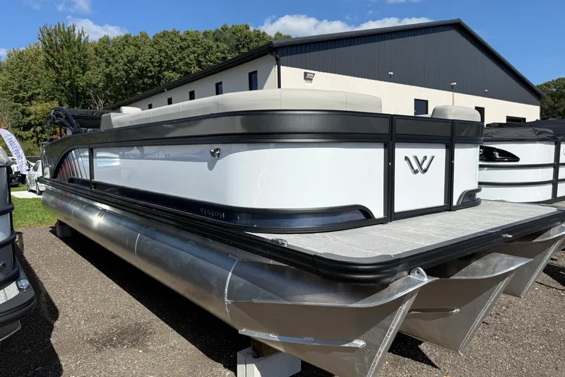 The Image of 2027 Whisper Vision Splash Pad pontoon boat displayed outdoors, featuring sleek design and modern aesthetics. - 0