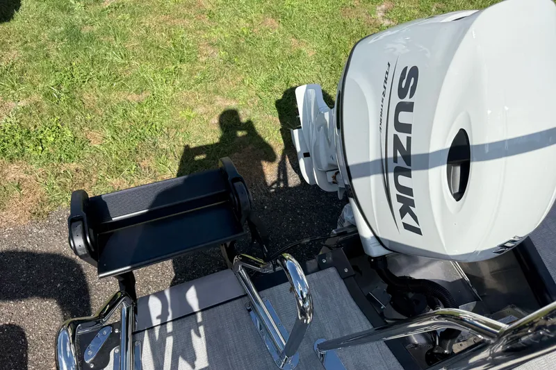 Slide: The Image of Outboard motor on Whisper Vision Splash Pad 2027, with shadow and grass background. - 18