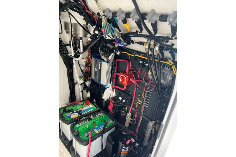 Slide: The Image of Electrical system of 2025 Delta Boatworks D245, featuring batteries and wiring components. - 23