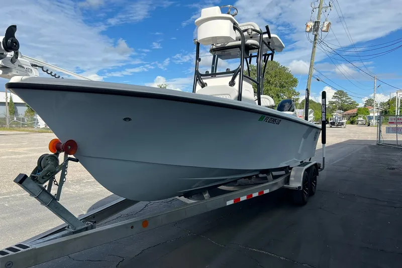 Slide: The Image of 2025 Delta Boatworks D245 on trailer, parked outdoors under a clear blue sky. - 24