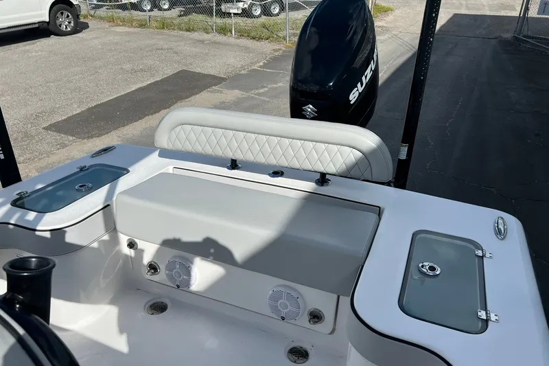 Slide: The Image of 2025 Delta Boatworks D245 interior with Suzuki engine, featuring cushioned seating and storage compartments. - 21