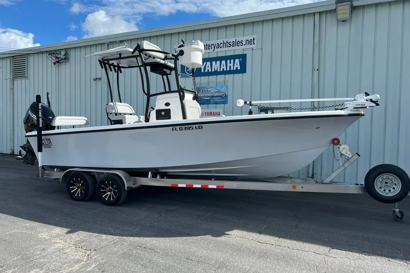 The Image of 2025 Delta Boatworks D245 on trailer, parked outside dealership with Yamaha signage. - 7