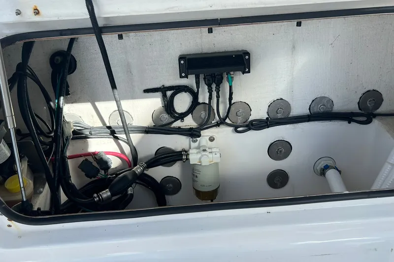 Slide: The Image of Interior view of 2025 Delta Boatworks D245 engine compartment with wiring and components. - 22